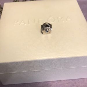 Pandora purse with blue gem charm